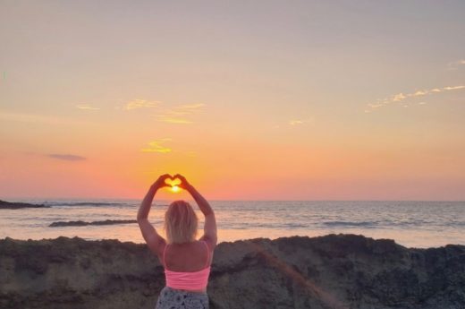 costa rica love heart sun set