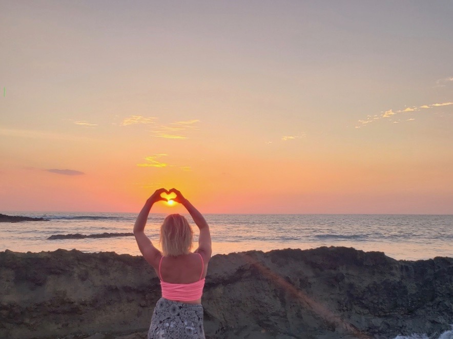 costa rica love heart sun set